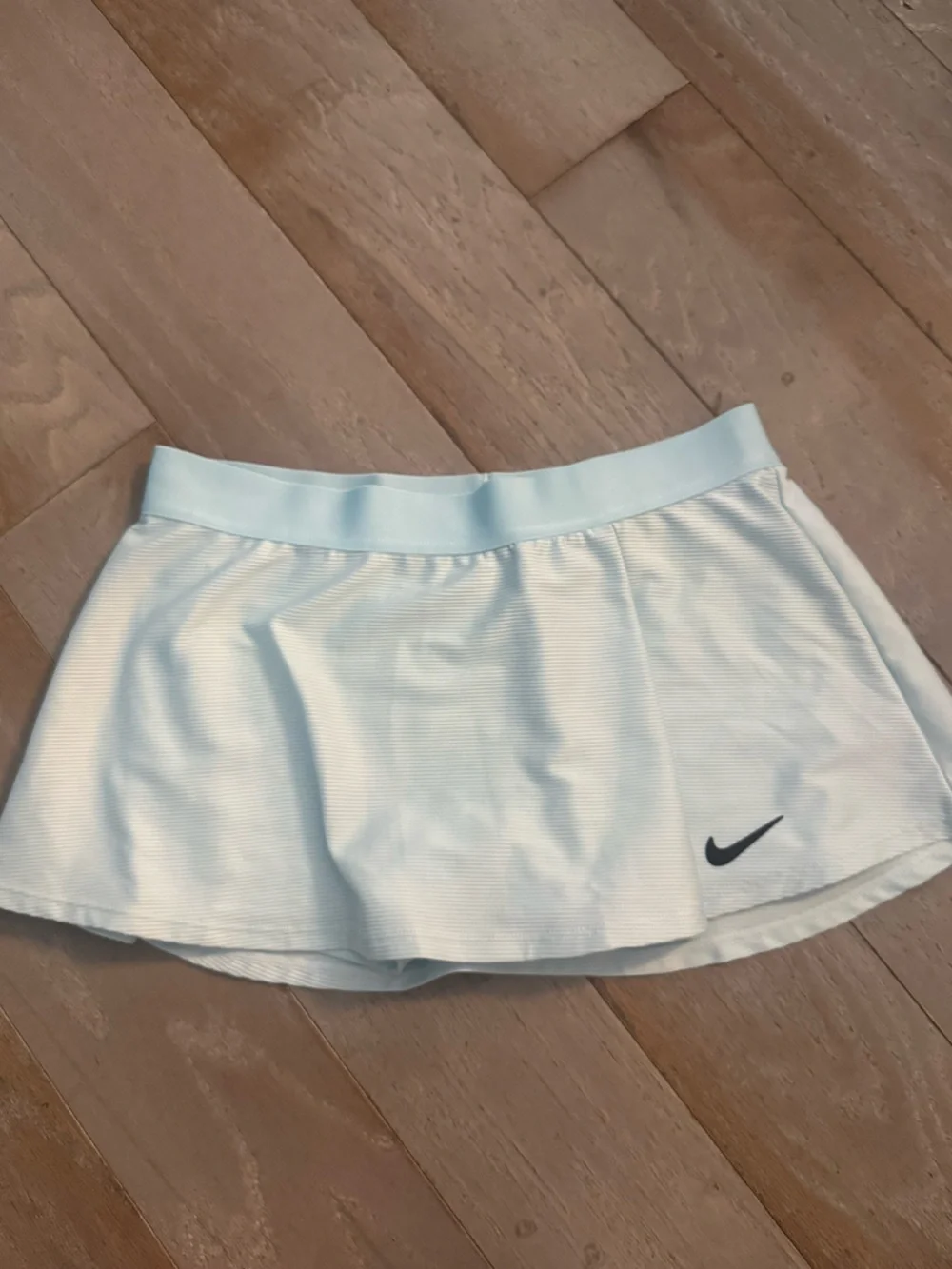 Nike Women’s Light Blue Tennis Skort with Black Swoosh